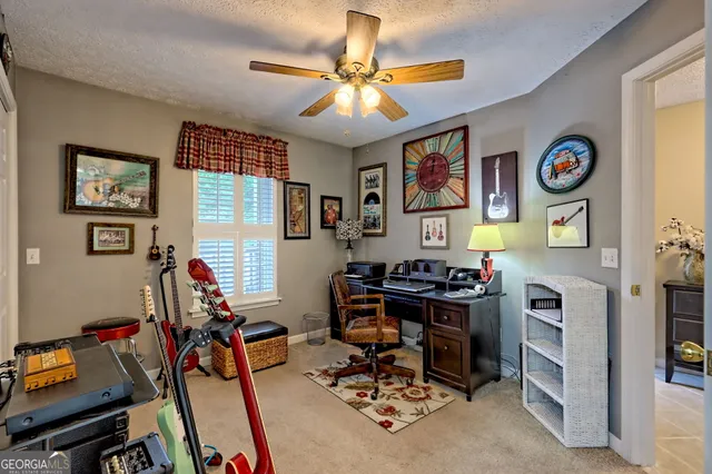 a aerial view of a house next to a big yard