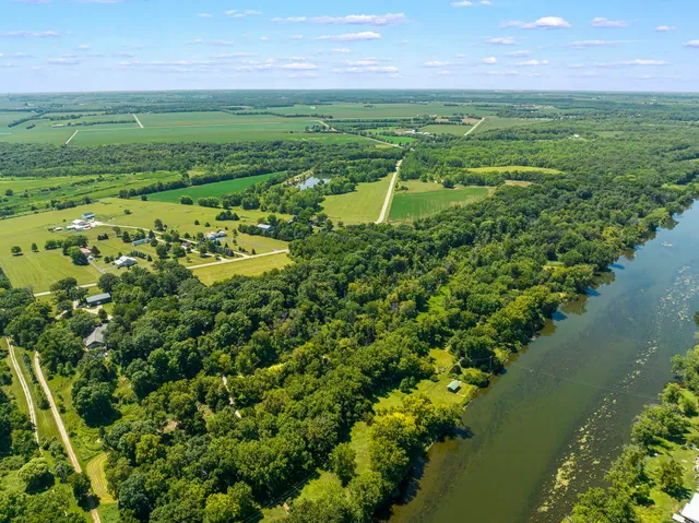 a view of a lake with a yard