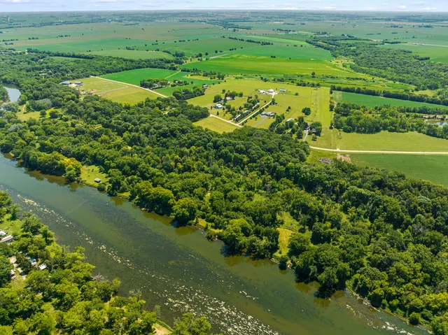 a view of a field with an ocean