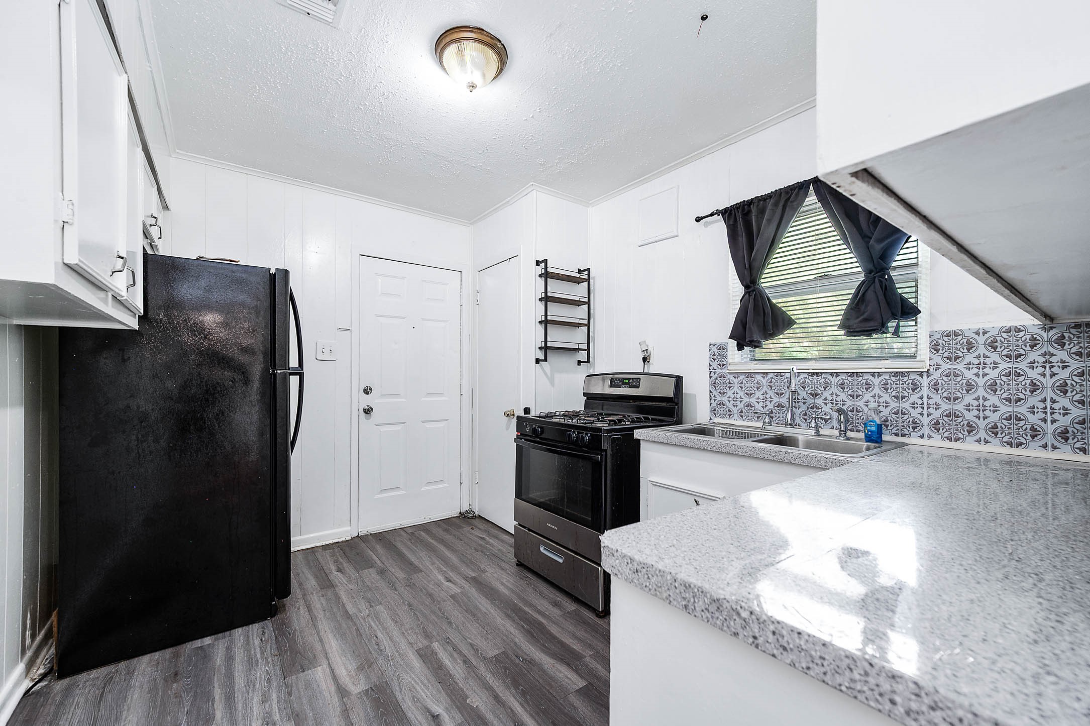 3723 Odin Court Houston, TX 77021 - Photo 15 of 19 a kitchen with a refrigerator and a stove