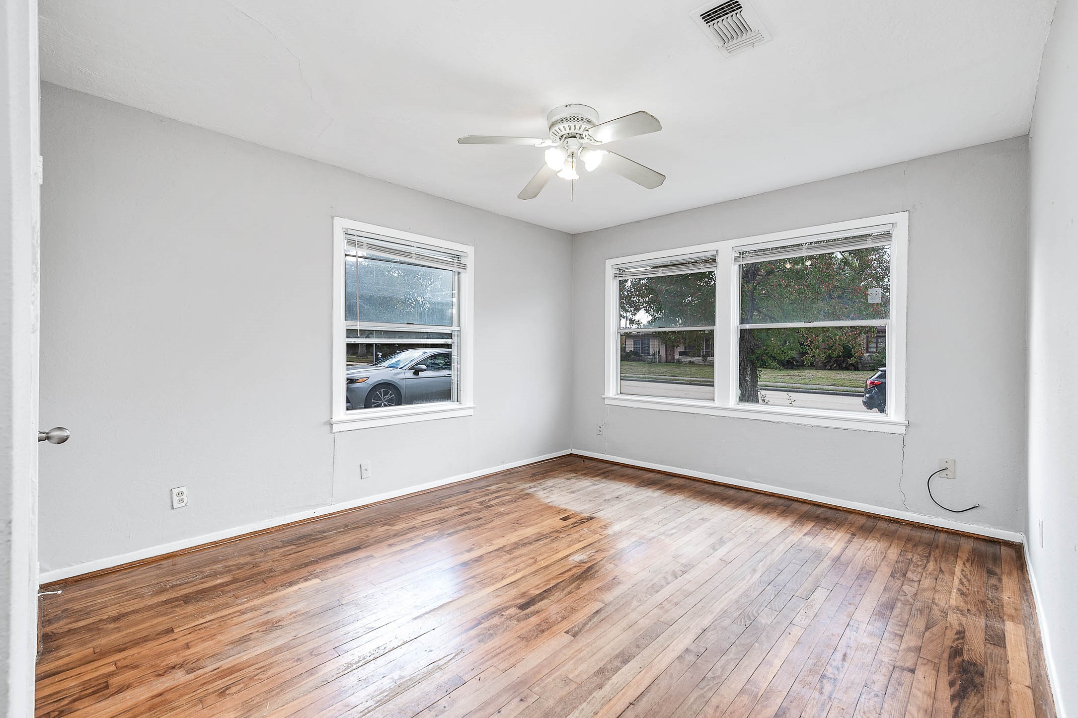 3723 Odin Court Houston, TX 77021 - Photo 10 of 19 a view of an empty room with wooden floor and a window