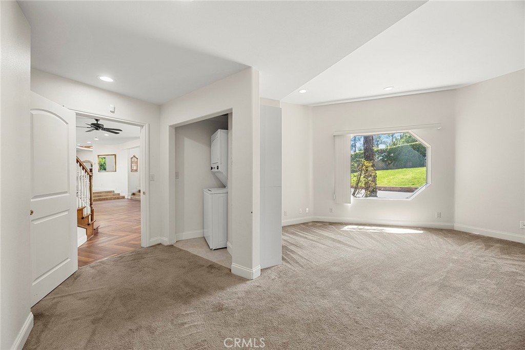 1730 Rocky Road Fullerton, CA 92831 - Photo 17 of 75 En-suite 1: First Floor- Featuring a spacious living area, two additional bedrooms, a full bathroom, and a convenient, tucked-away laundry closet.