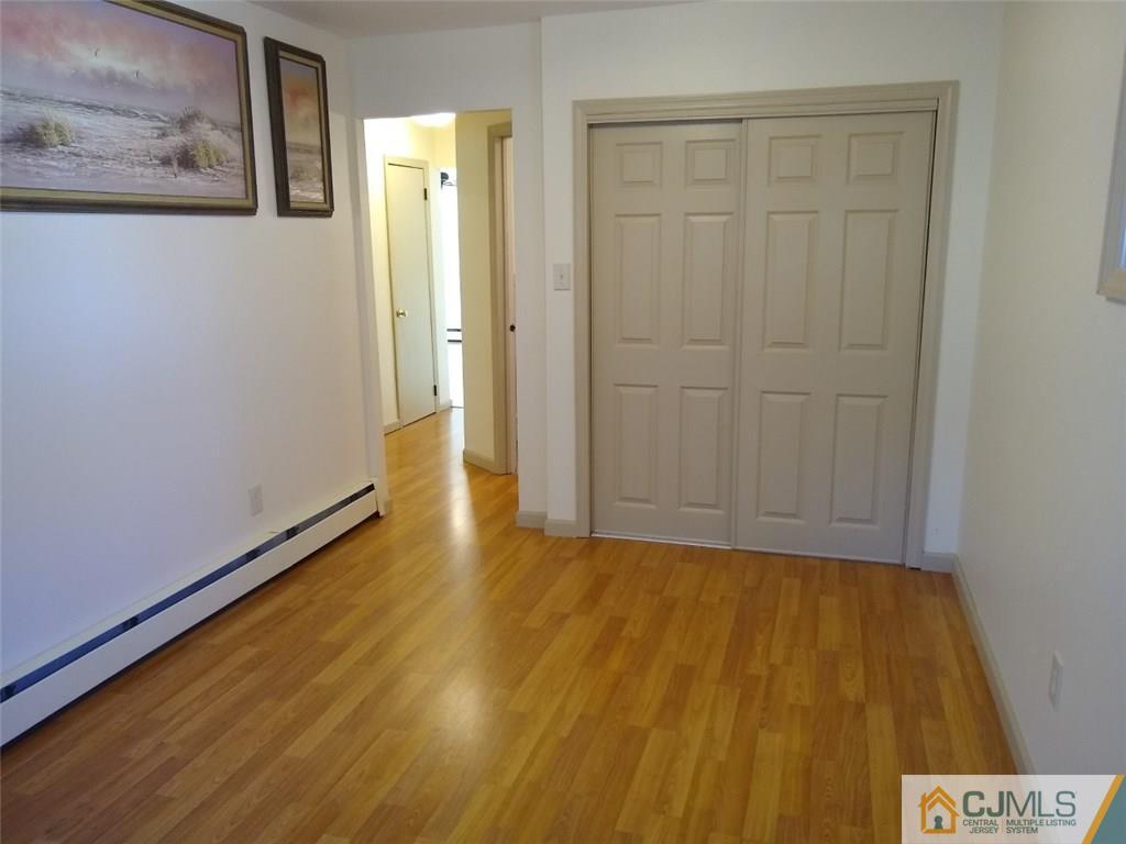 29 Richmond Road Edison, NJ 08817 - Photo 14 of 31 a view of an empty room with wooden floor