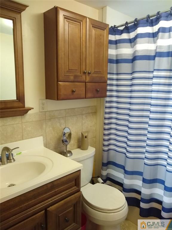 29 Richmond Road Edison, NJ 08817 - Photo 21 of 31 a bathroom with a sink toilet and shower