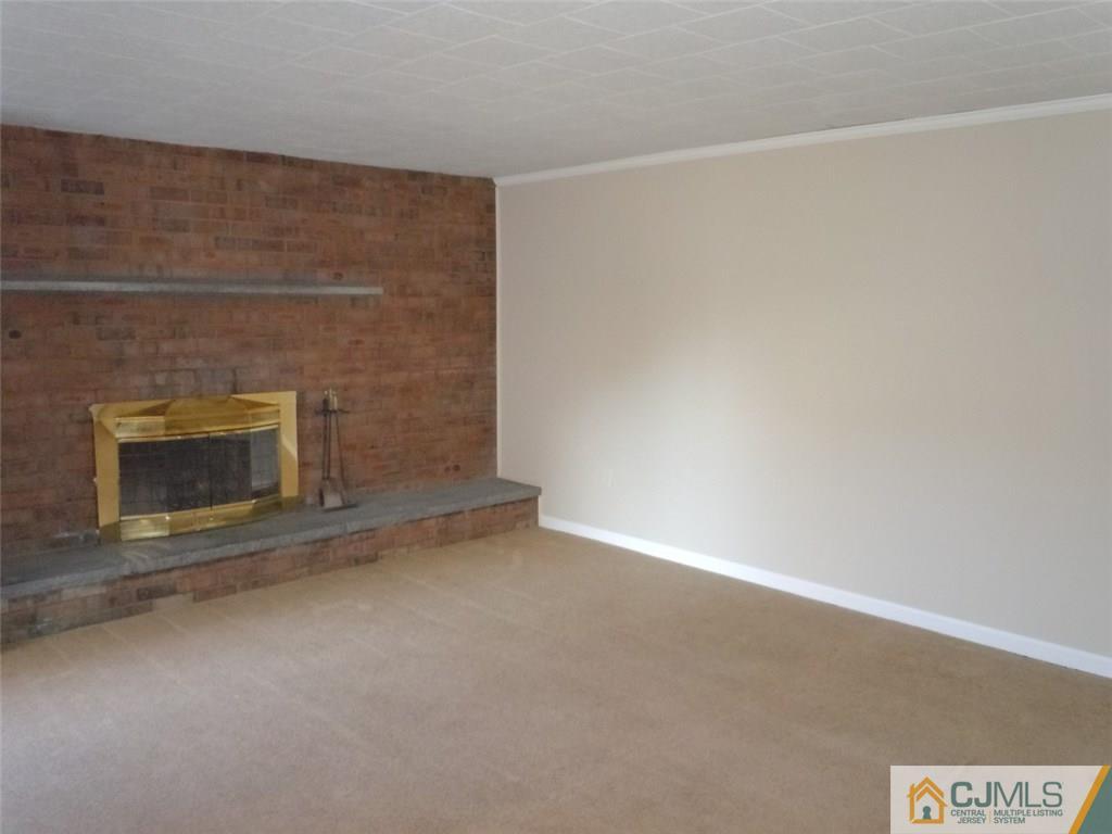 29 Richmond Road Edison, NJ 08817 - Photo 5 of 31 a view of empty room with a fireplace
