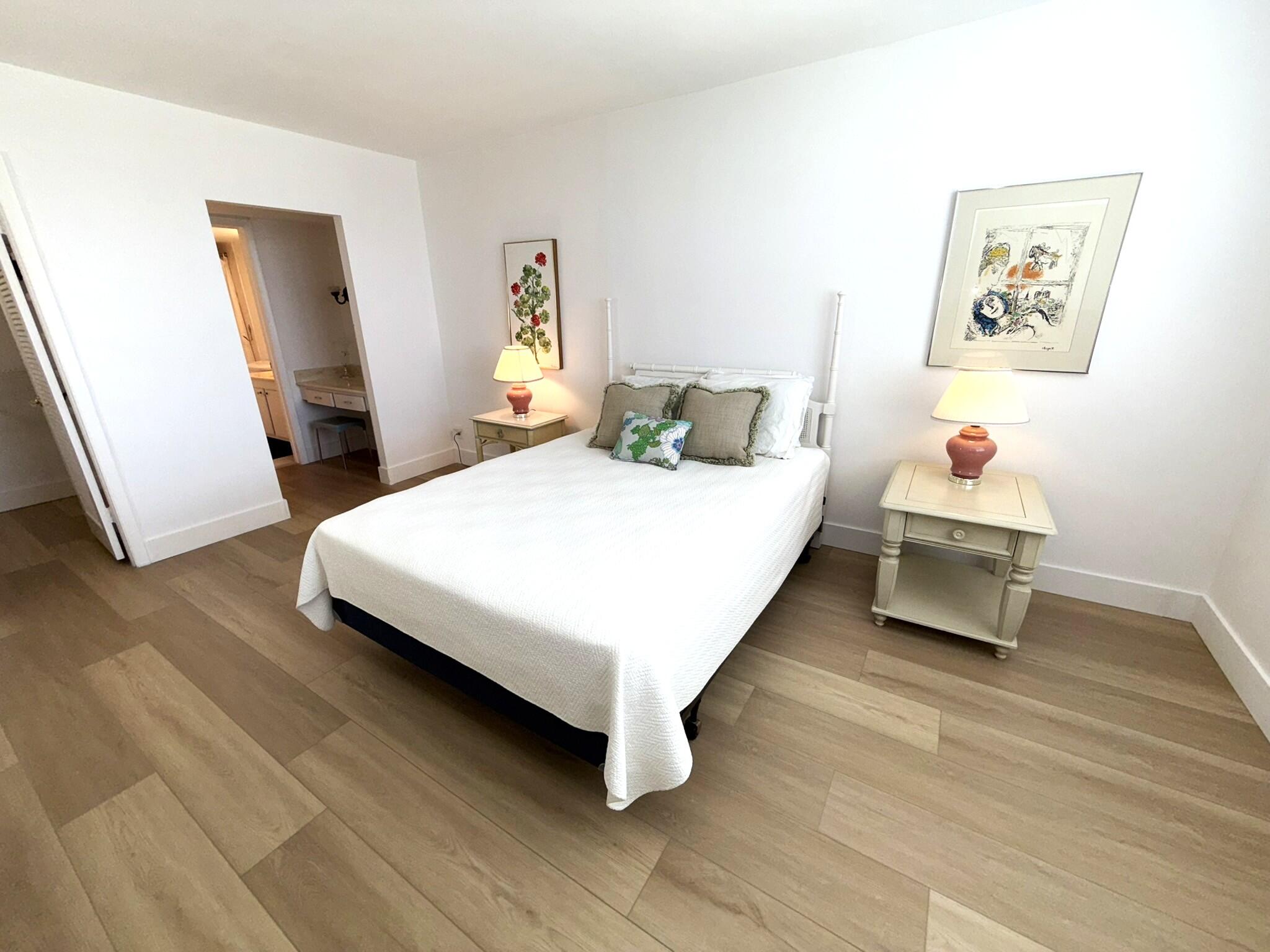 2860 South Ocean Boulevard, Unit 415 Palm Beach, FL 33480 - Photo 12 of 24 a bedroom with a bed and a dresser