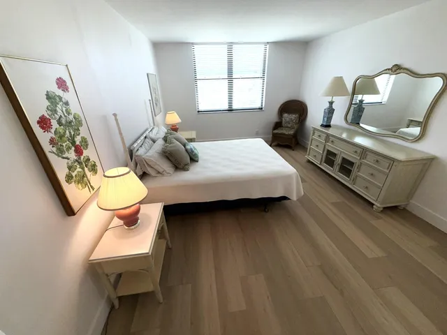 a bedroom with bed and window