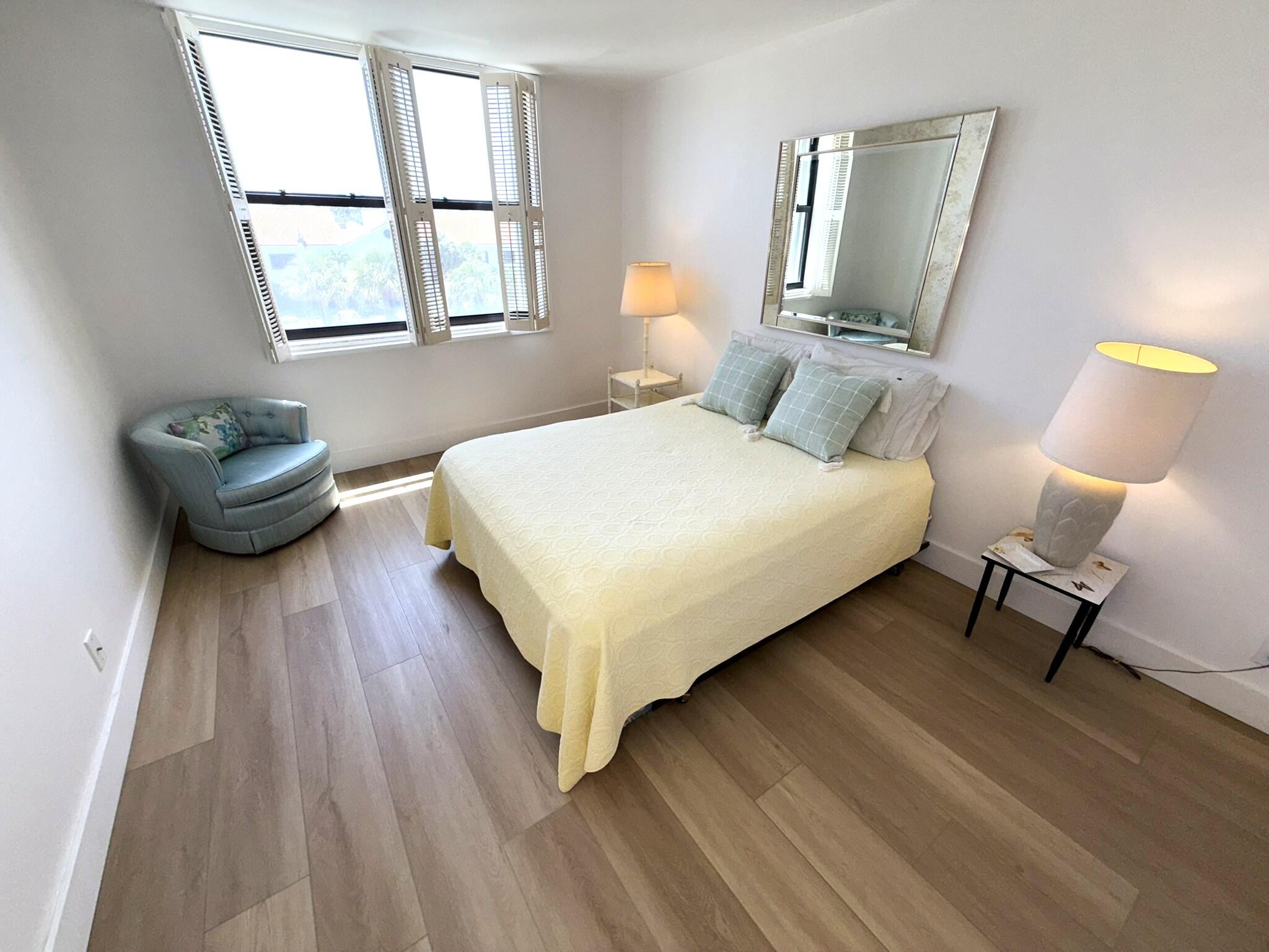 2860 South Ocean Boulevard, Unit 415 Palm Beach, FL 33480 - Photo 17 of 24 a bedroom with a bed and window