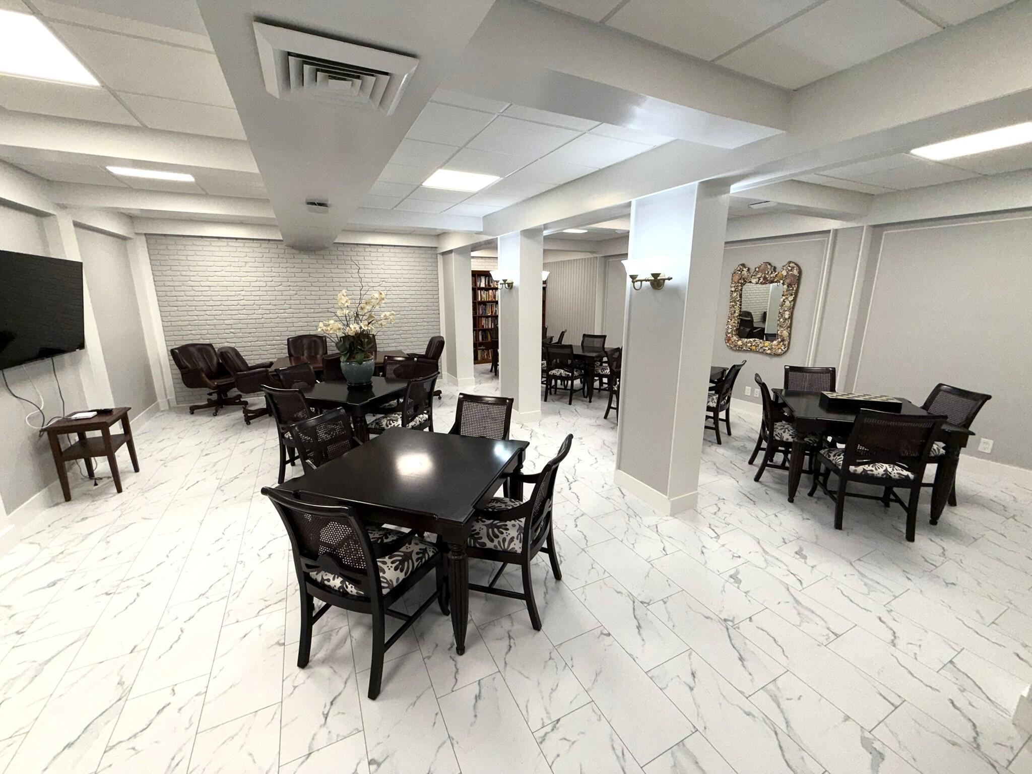 2860 South Ocean Boulevard, Unit 415 Palm Beach, FL 33480 - Photo 22 of 24 a view of a dining room with furniture