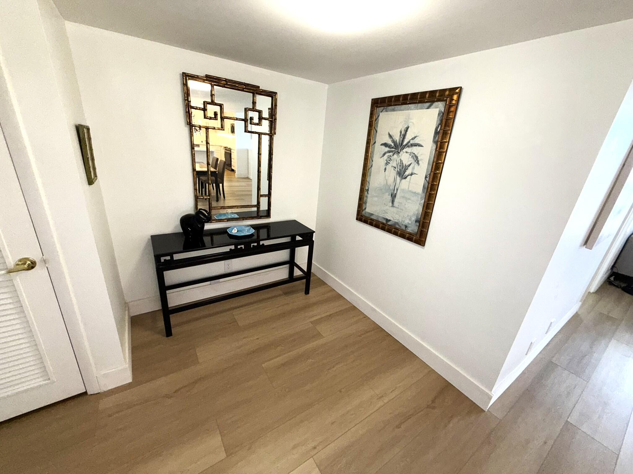 2860 South Ocean Boulevard, Unit 415 Palm Beach, FL 33480 - Photo 4 of 24 a view of room with window and wooden floor