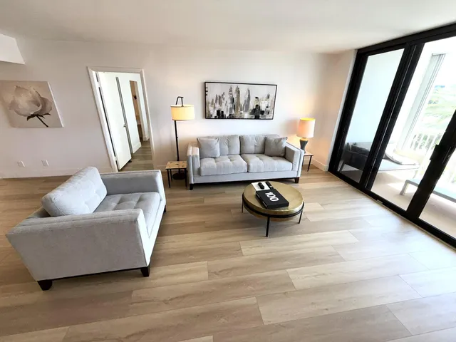 a living room with furniture and a rug