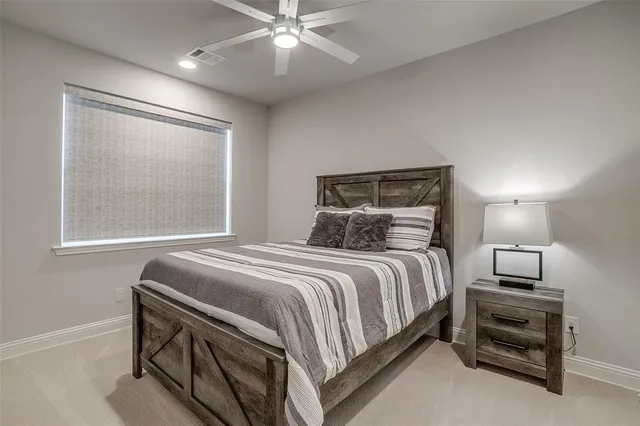 a bedroom with a bed and a tv