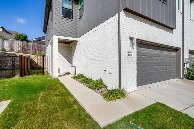 a view of small house with backyard