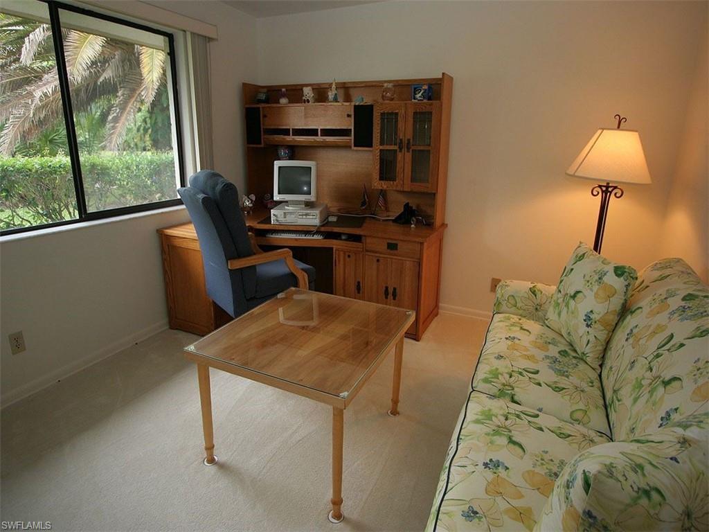 1961 Imperial Golf Course Boulevard Naples, FL 34110 - Photo 10 of 13 a room with furniture and a window