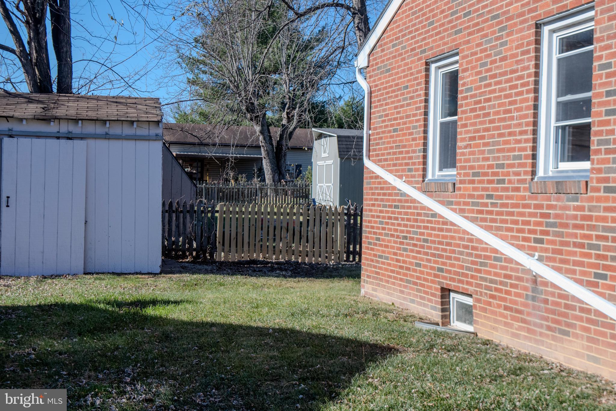 219 Virginia Street Strasburg, VA 22657 - Photo 28 of 29 a view of a house with a yard and deck