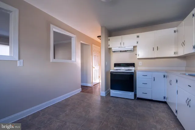 a bathroom with a shower and a sink