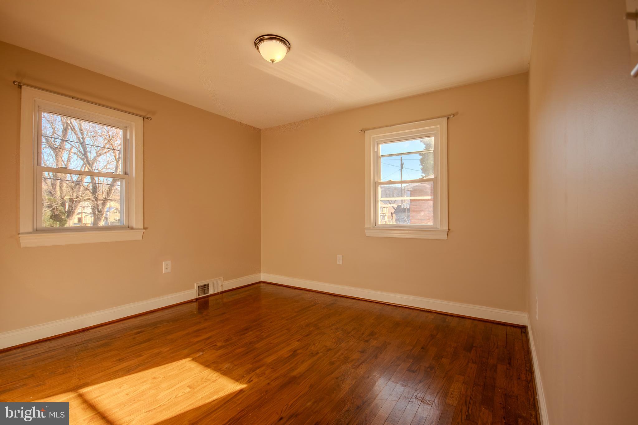219 Virginia Street Strasburg, VA 22657 - Photo 9 of 29 a view of empty room with wooden floor and fan