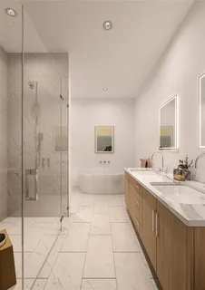 a bathroom with a tub sink and mirror