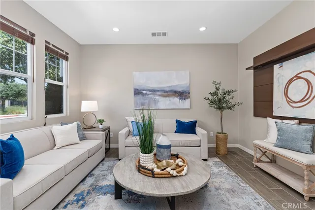 a living room with furniture and a large window