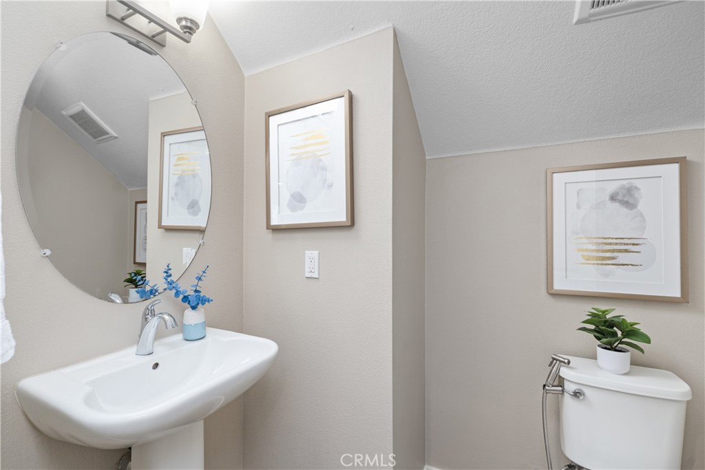 78 Patria Rancho Mission Viejo, CA 92694 - Photo 24 of 56 a bathroom with a sink a mirror and a toilet
