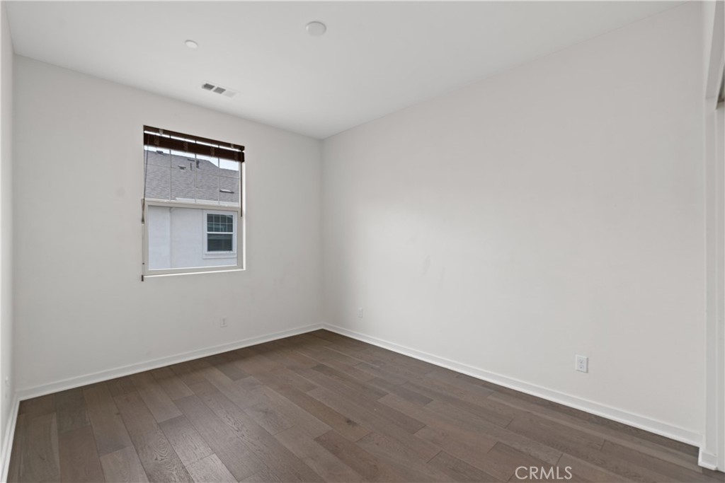 78 Patria Rancho Mission Viejo, CA 92694 - Photo 25 of 56 a view of an empty room with wooden floor and a window