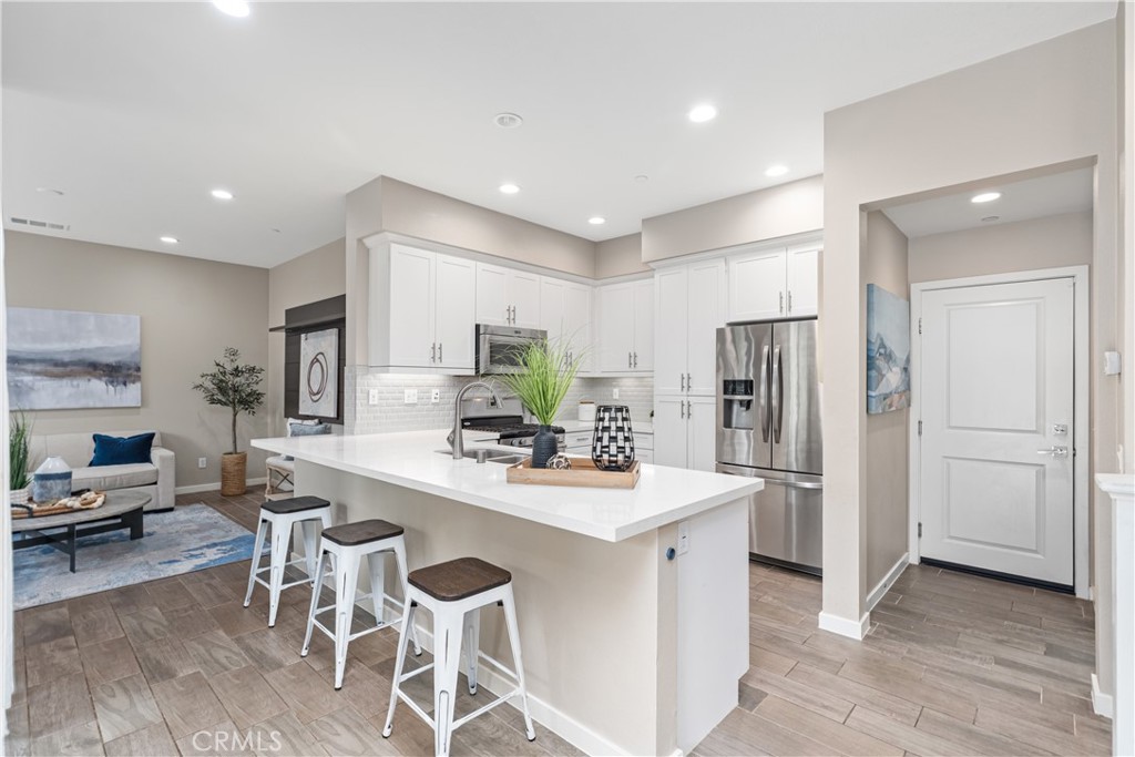 78 Patria Rancho Mission Viejo, CA 92694 - Photo 4 of 56 a kitchen with stainless steel appliances kitchen island granite countertop a refrigerator and a stove top oven