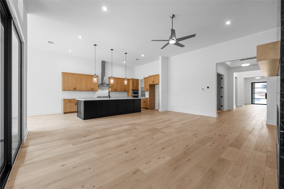 1304 Novara Trail Leander, TX 78641 - Photo 24 of 25 a large room with kitchen view and a refrigerator