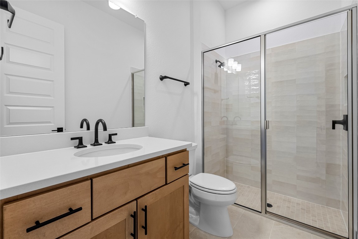 1304 Novara Trail Leander, TX 78641 - Photo 7 of 25 a bathroom with a sink toilet and shower