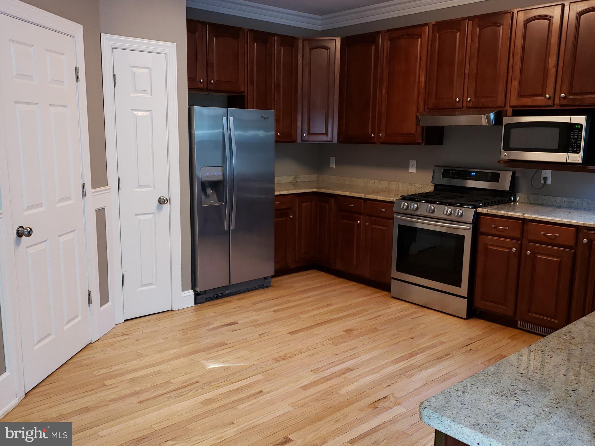 1321 Emmanuel Church Road Huntingtown, MD 20639 - Photo 8 of 30 Pantry, Laundry, Samsung Gas Range