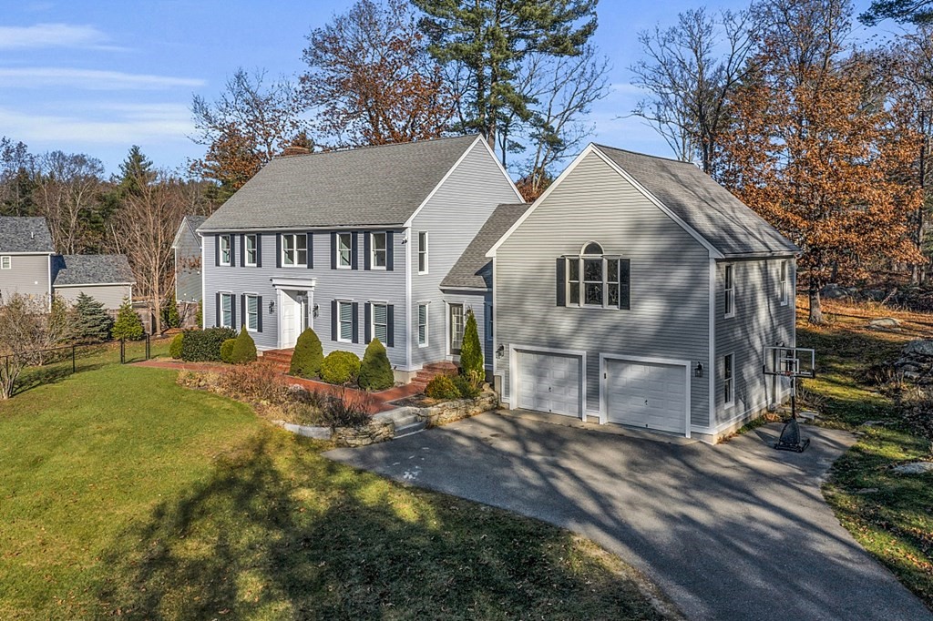 154 Shaker Road Harvard, MA 01451 - Photo 3 of 4 a front view of a house with garden