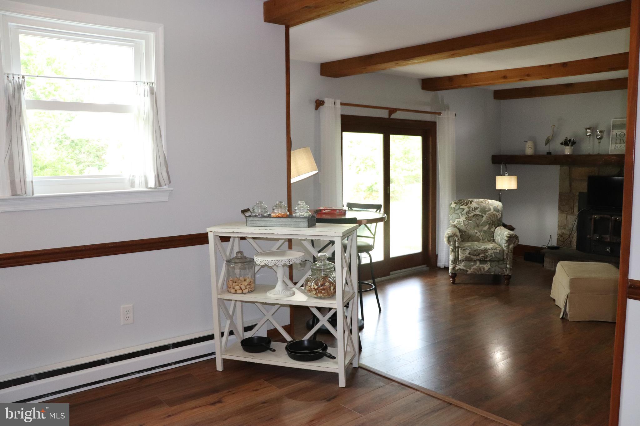 2181 School Road Pottstown, PA 19465 - Photo 12 of 42 a living room with furniture and a wooden floor