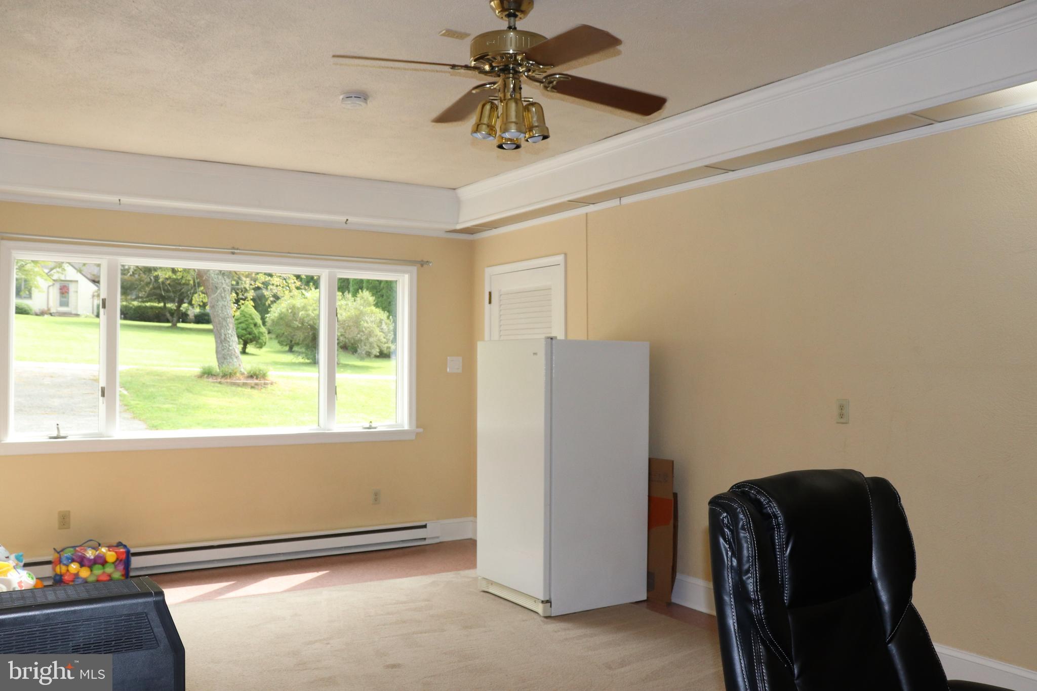 2181 School Road Pottstown, PA 19465 - Photo 18 of 42 a view of workspace with window and a ceiling fan