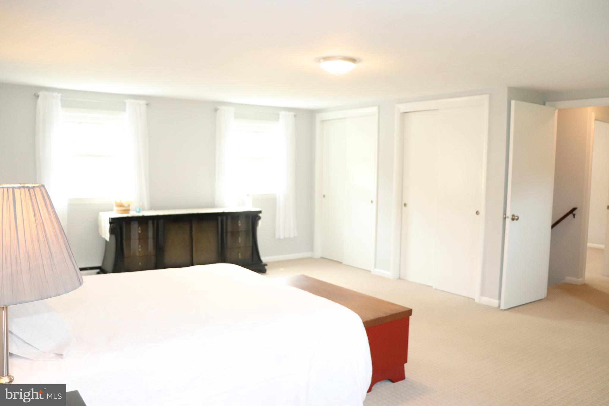 2181 School Road Pottstown, PA 19465 - Photo 23 of 42 a large white bed in a white room