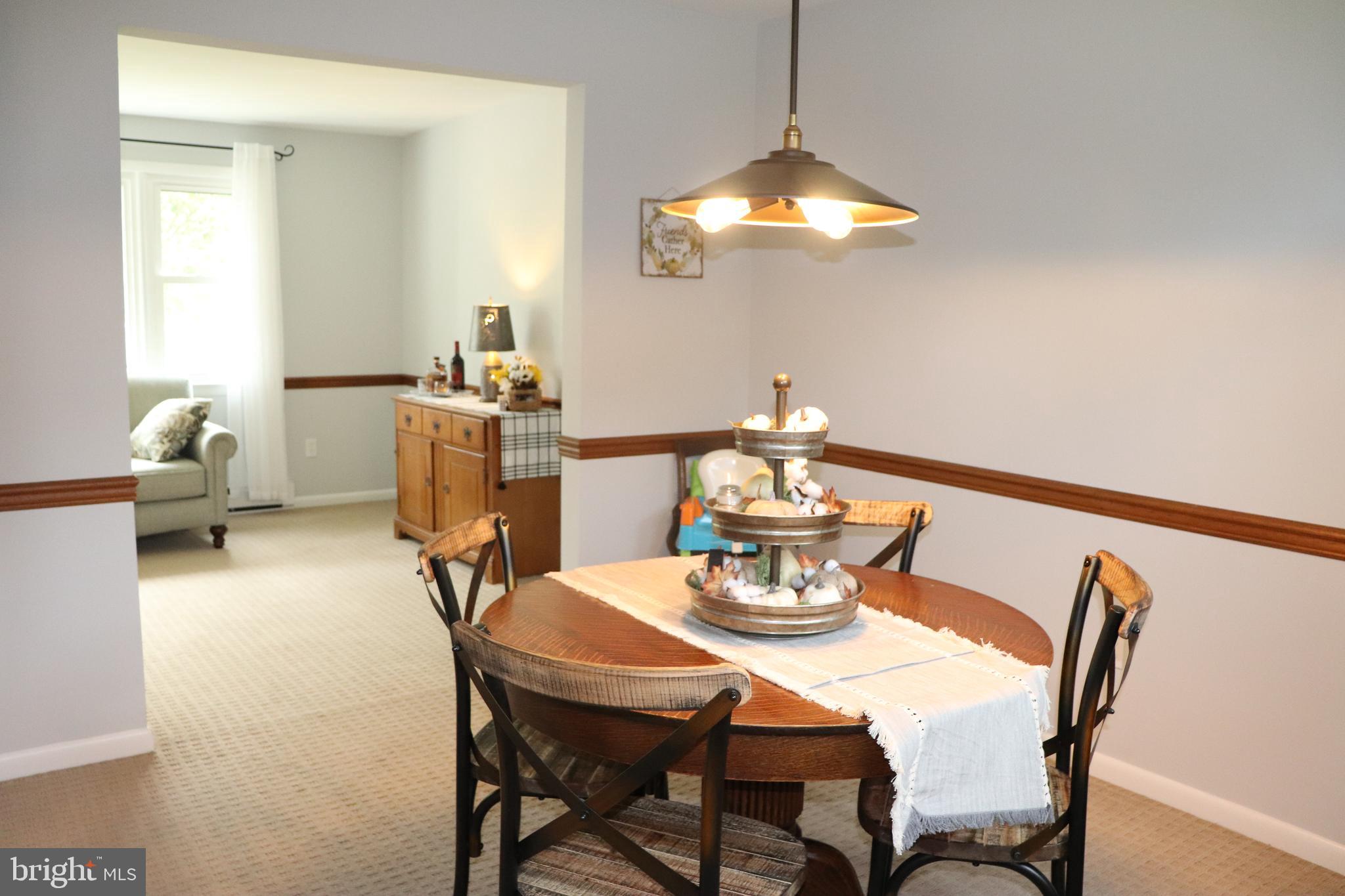 2181 School Road Pottstown, PA 19465 - Photo 7 of 42 a dining room with furniture a chandelier and window