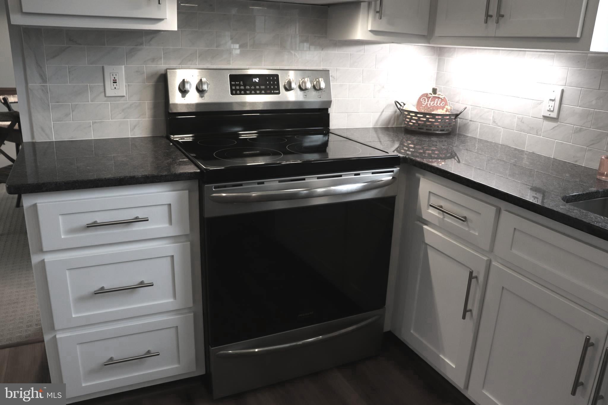 2181 School Road Pottstown, PA 19465 - Photo 10 of 42 a stove top oven sitting inside of a kitchen