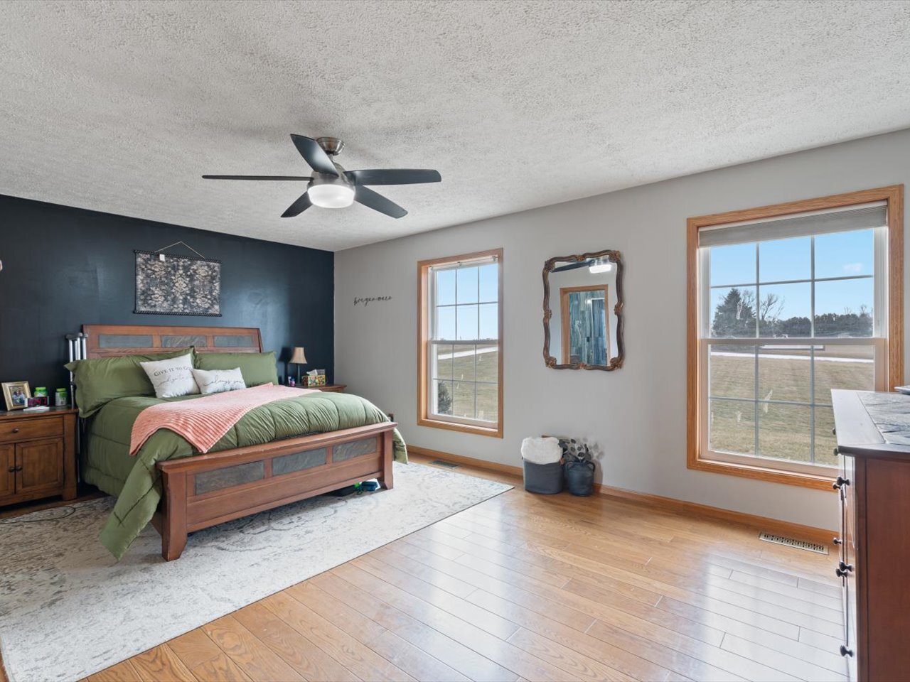 2572 160th Avenue Aledo, IL 61231 - Photo 31 of 66 a bedroom with a bed and wooden floor