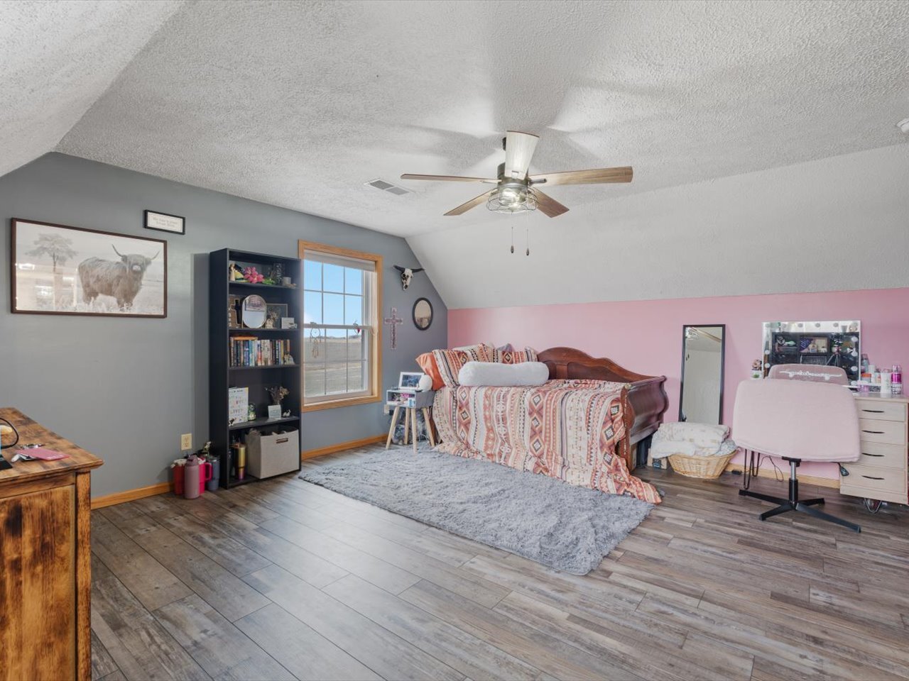 2572 160th Avenue Aledo, IL 61231 - Photo 41 of 66 a spacious bedroom with a bed and a wooden floor