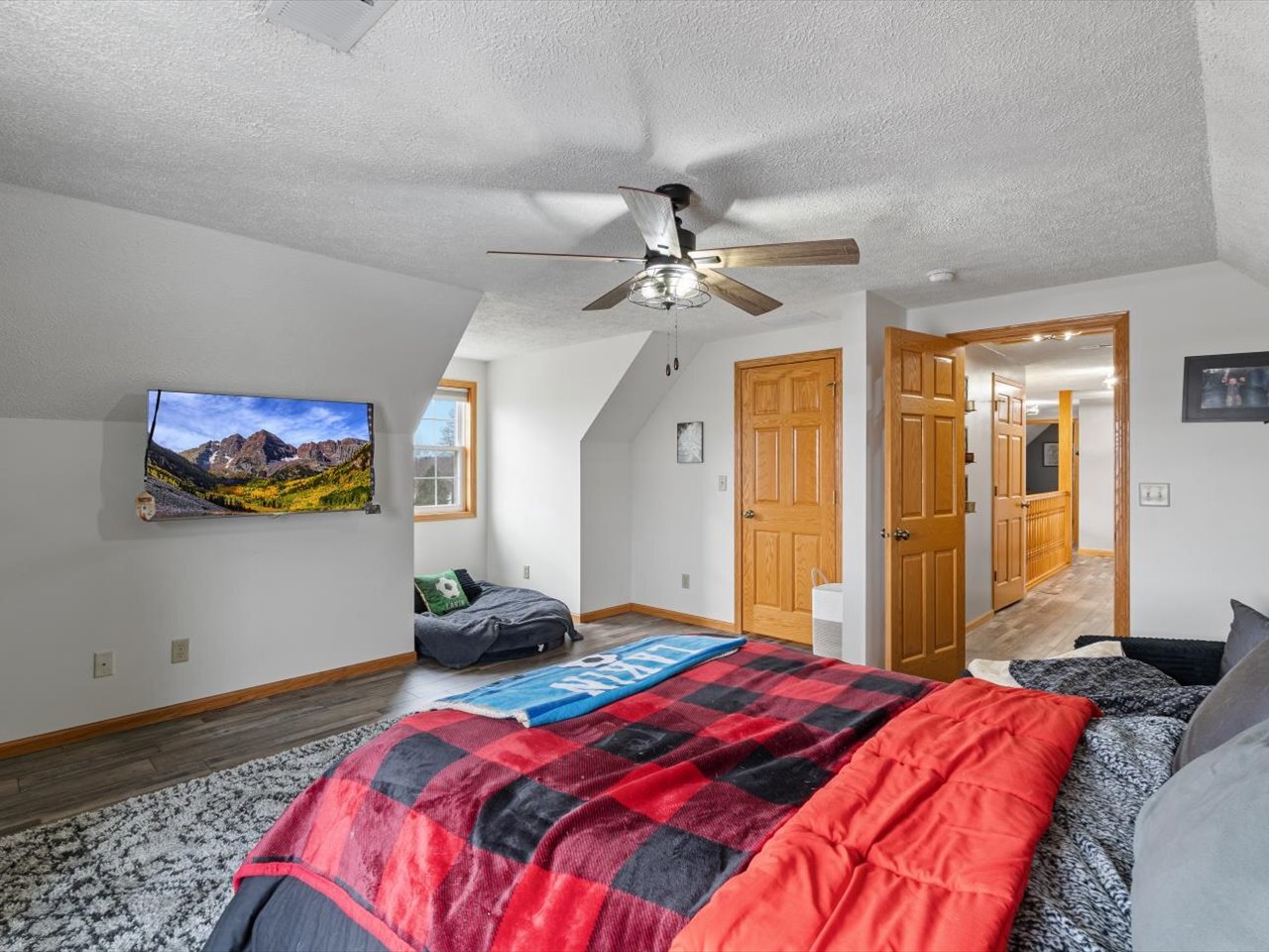 2572 160th Avenue Aledo, IL 61231 - Photo 48 of 66 a bedroom with a bed and a chandelier