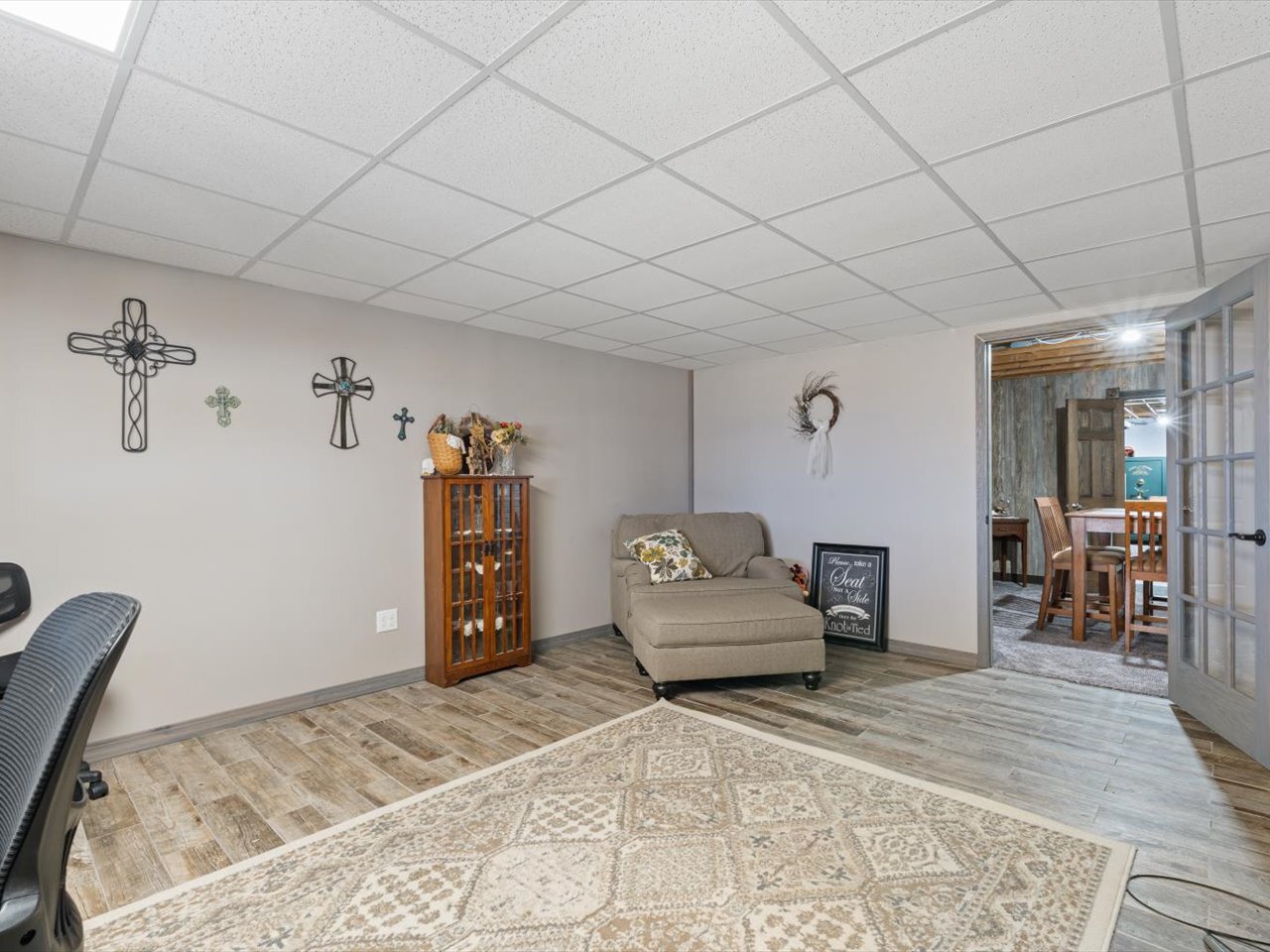 2572 160th Avenue Aledo, IL 61231 - Photo 53 of 66 a bedroom with a large bed and a chandelier