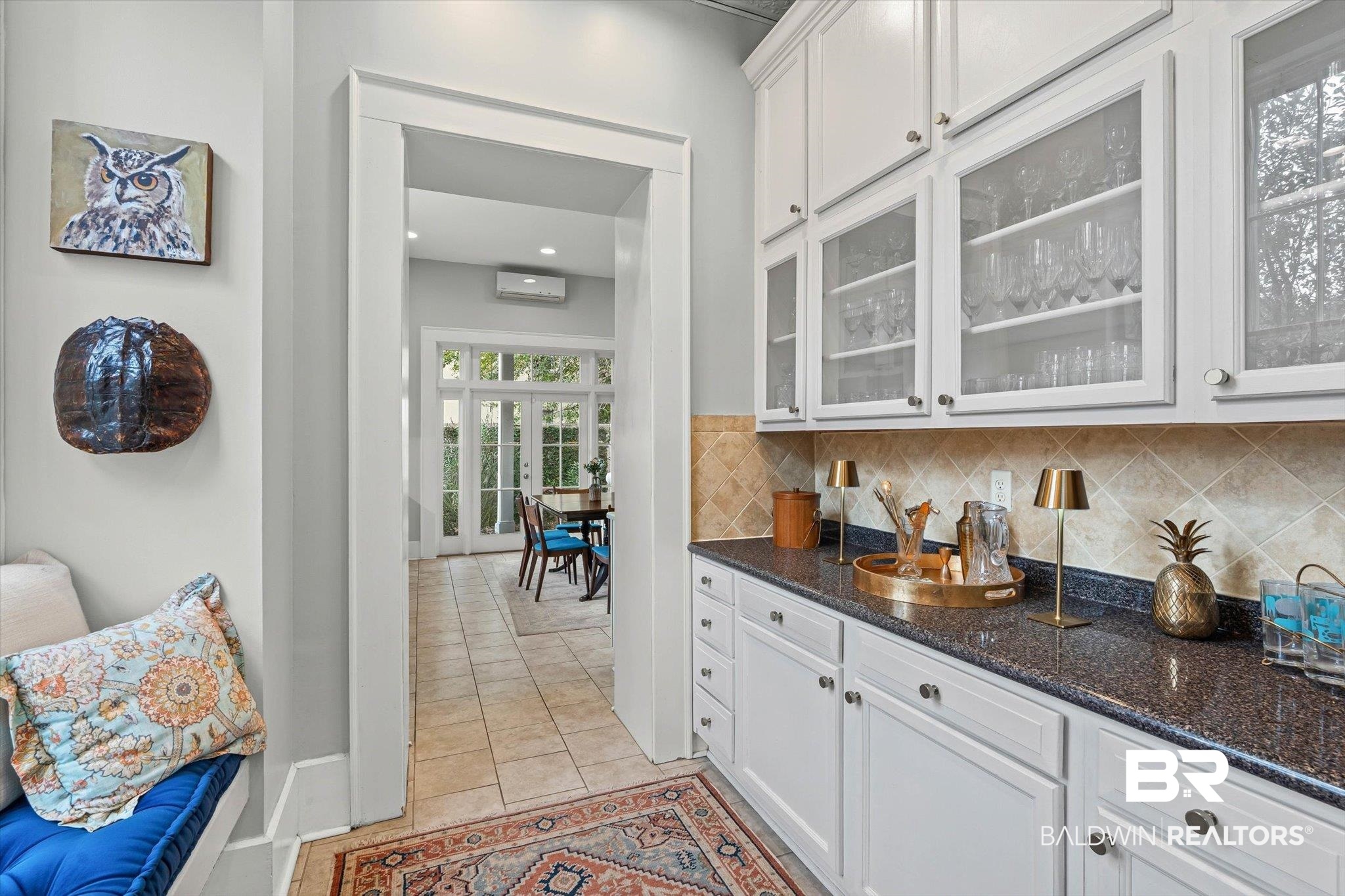 259 North Jackson Street Mobile, AL 36603 - Photo 10 of 42 Bar area featuring white cabinetry, dark stone countertops, light tile patterned flooring, recessed lighting, and backsplash