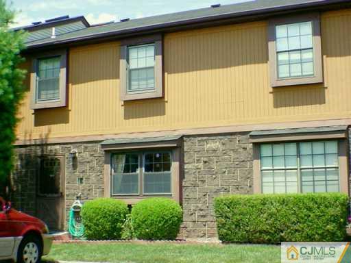 8403 Hana Road Edison, NJ 08817 - Photo 2 of 2 a front view of a house having yard