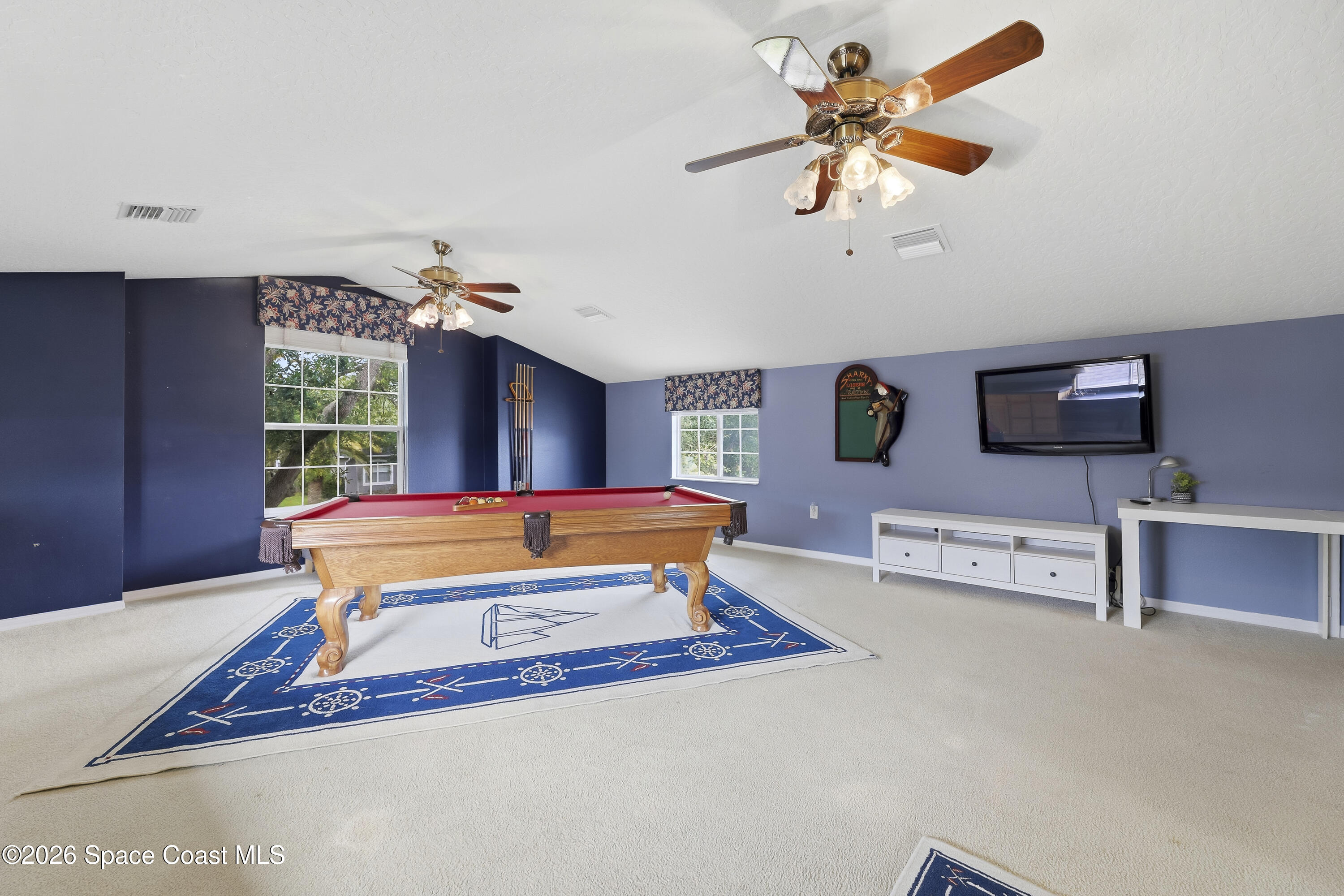 1643 Long Pine Road Melbourne, FL 32940 - Photo 43 of 63 a bedroom with furniture and a large window
