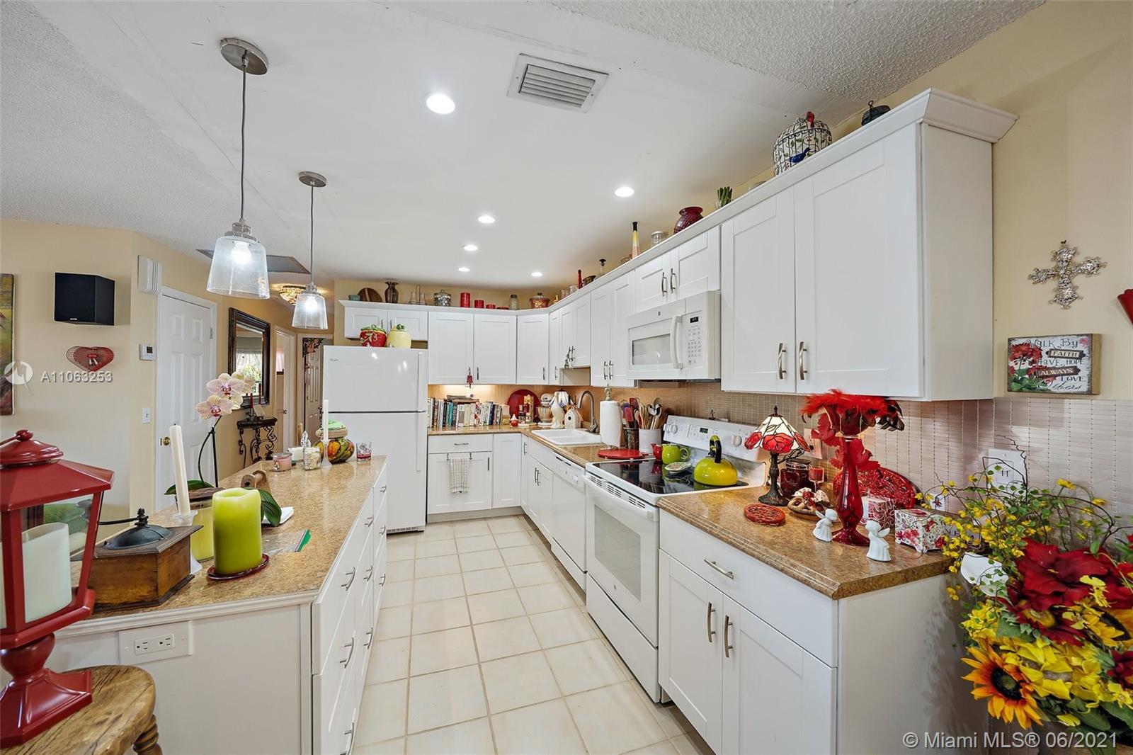 19 Shay Place Tequesta, FL 33469 - Photo 13 of 54 a large kitchen with lots of counter top space