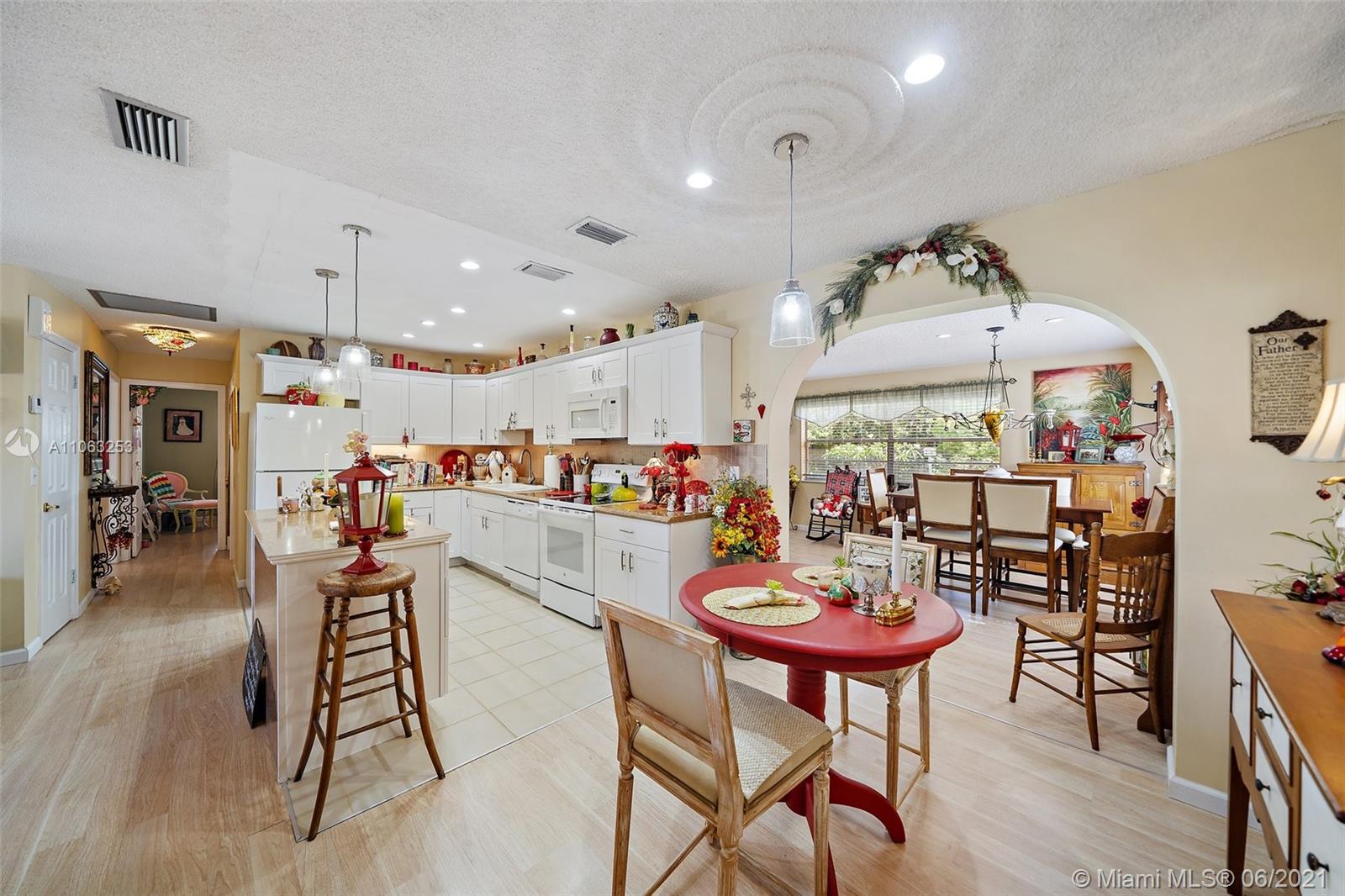19 Shay Place Tequesta, FL 33469 - Photo 15 of 54 a dining room with furniture and a kitchen view