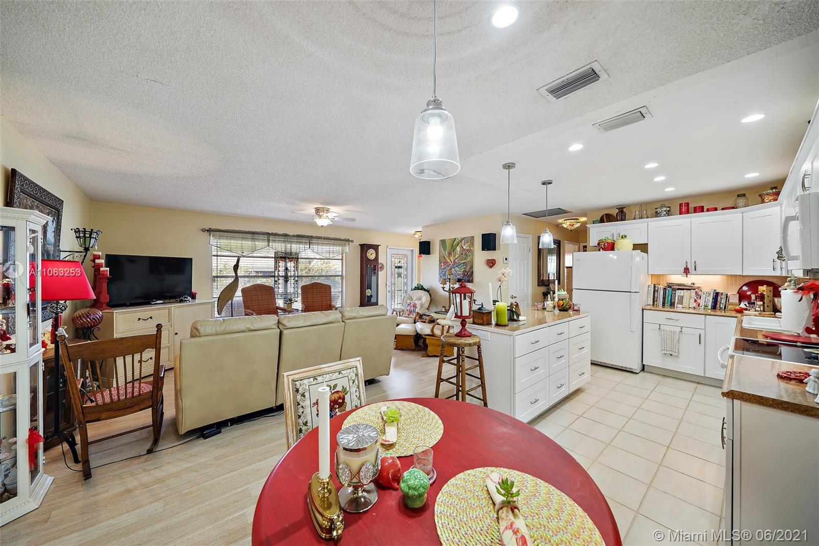 19 Shay Place Tequesta, FL 33469 - Photo 16 of 54 a living room with furniture and flat screen tv