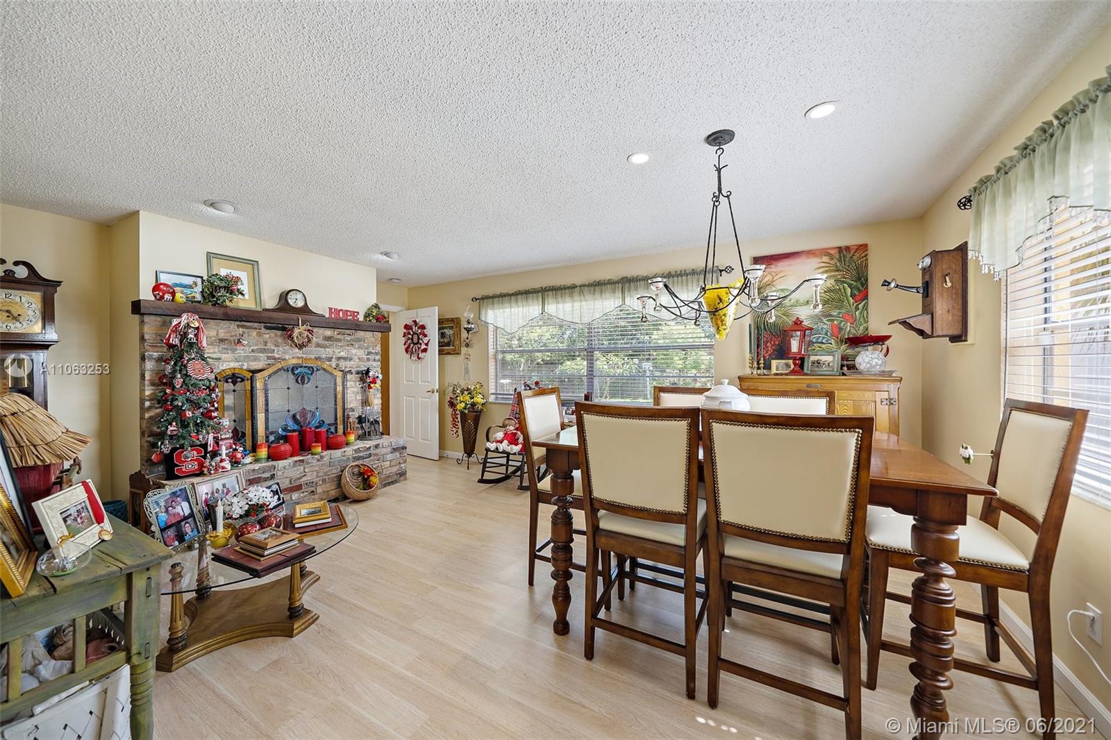 19 Shay Place Tequesta, FL 33469 - Photo 19 of 54 a view of a dining room with furniture window and outside view