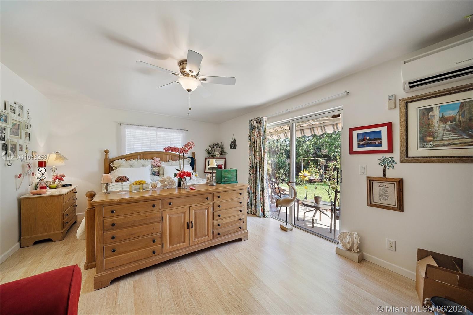 19 Shay Place Tequesta, FL 33469 - Photo 20 of 54 a bedroom with furniture and a window