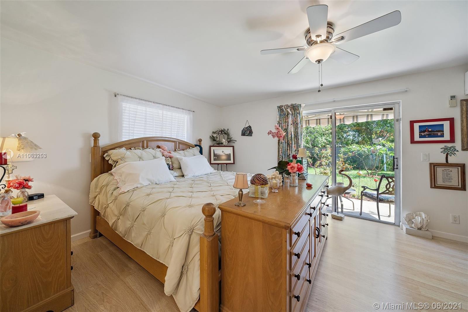 19 Shay Place Tequesta, FL 33469 - Photo 21 of 54 a bedroom with furniture and a window