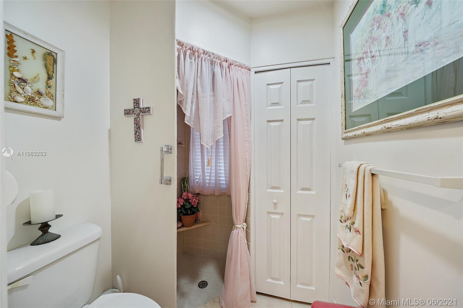 19 Shay Place Tequesta, FL 33469 - Photo 24 of 54 a bathroom with a shower toilet and sink