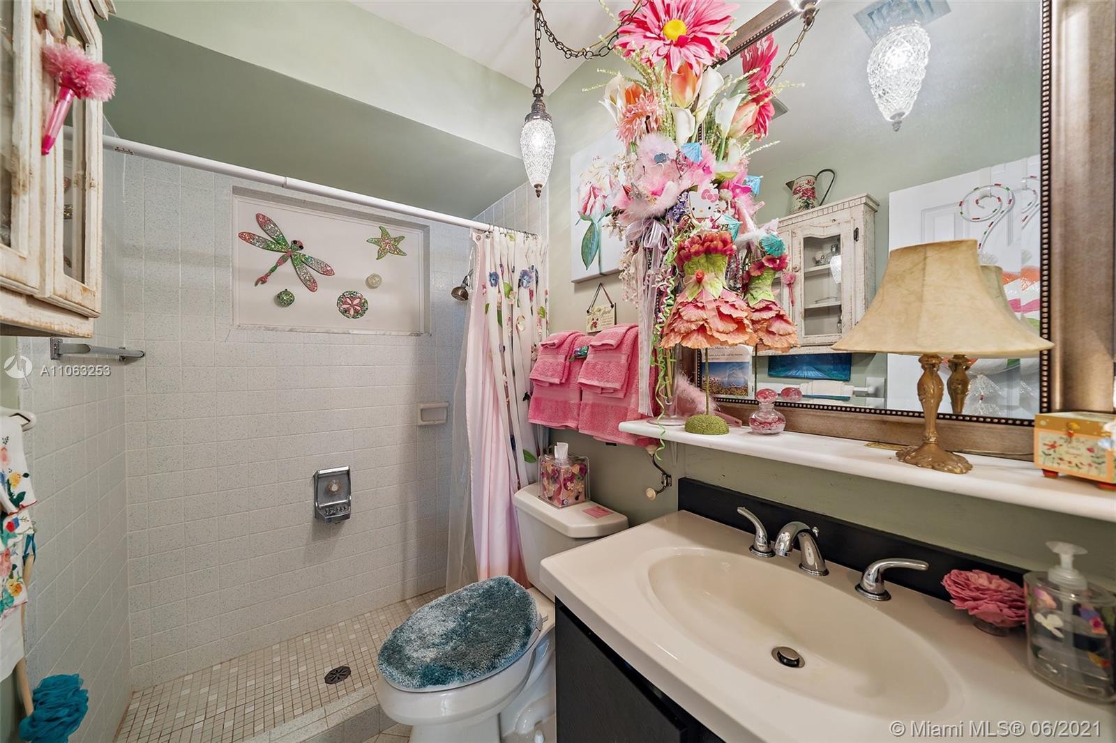 19 Shay Place Tequesta, FL 33469 - Photo 30 of 54 a bathroom with a sink toilet and shower